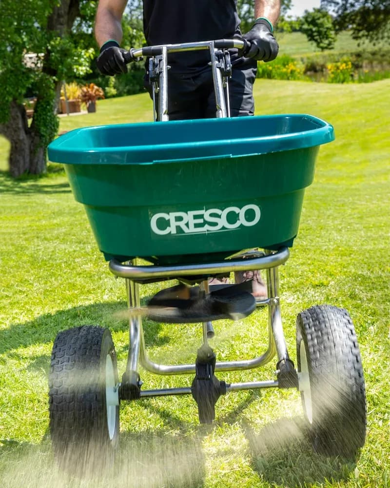Cresco walk-behind spreader spreading salt